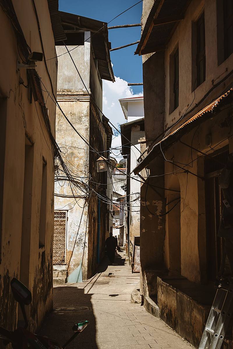 Guided photowalk through a narrow Stone Town alley in Zanzibar